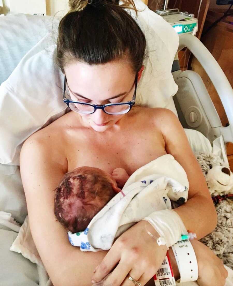 mom trying to breast feed new born son