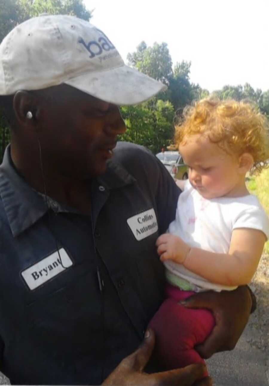 man holding the baby he rescued