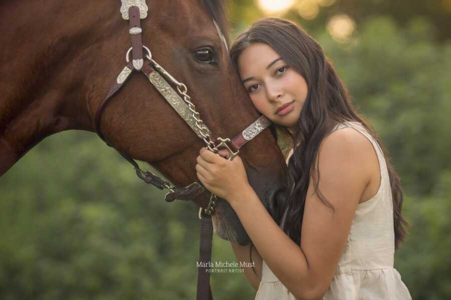 girl who was shot in oxford shooting with her horse being held close