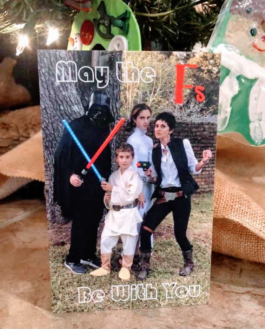 A family Christmas photo dressed in Halloween Star Wars costumes