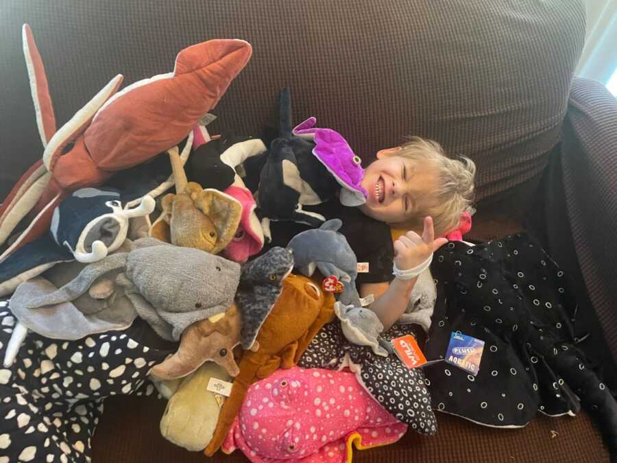 little boy buried in stuffed animals after reddit users send them to him