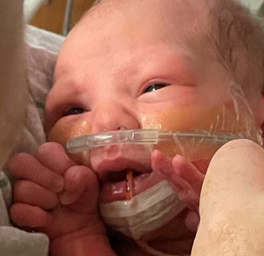 Newborn baby stares up at her mom after traumatic birth