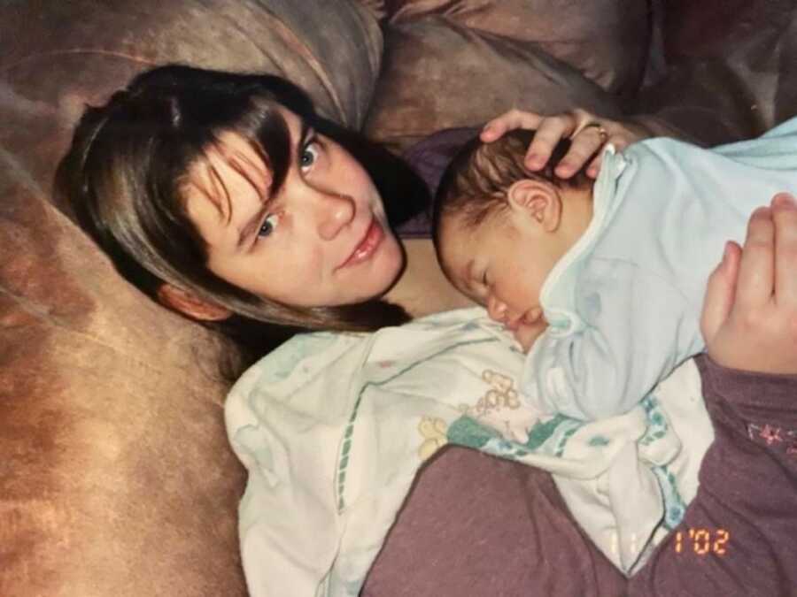 mom with her new born son sleeping on her chest