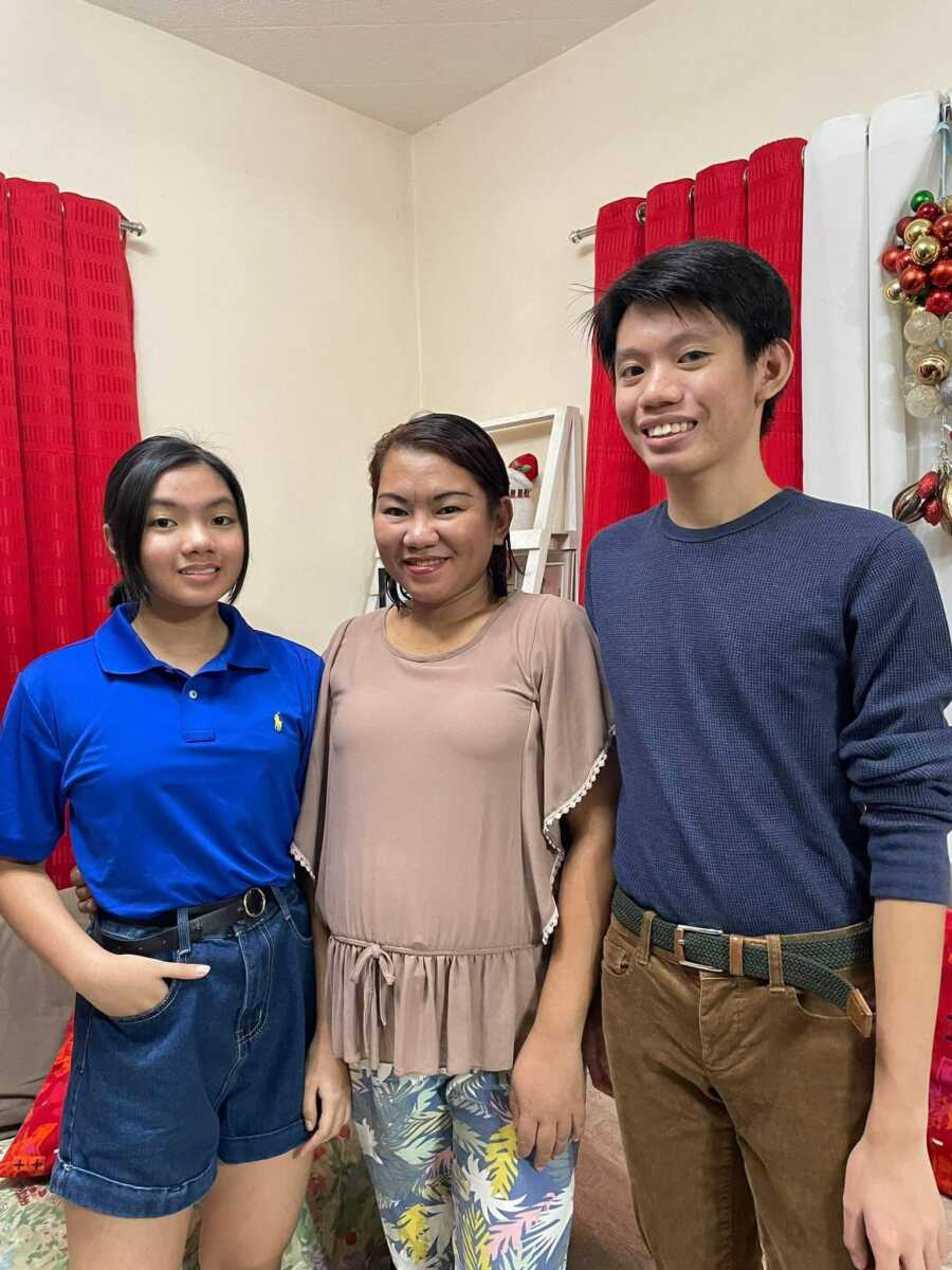 mom with her two kids smiling