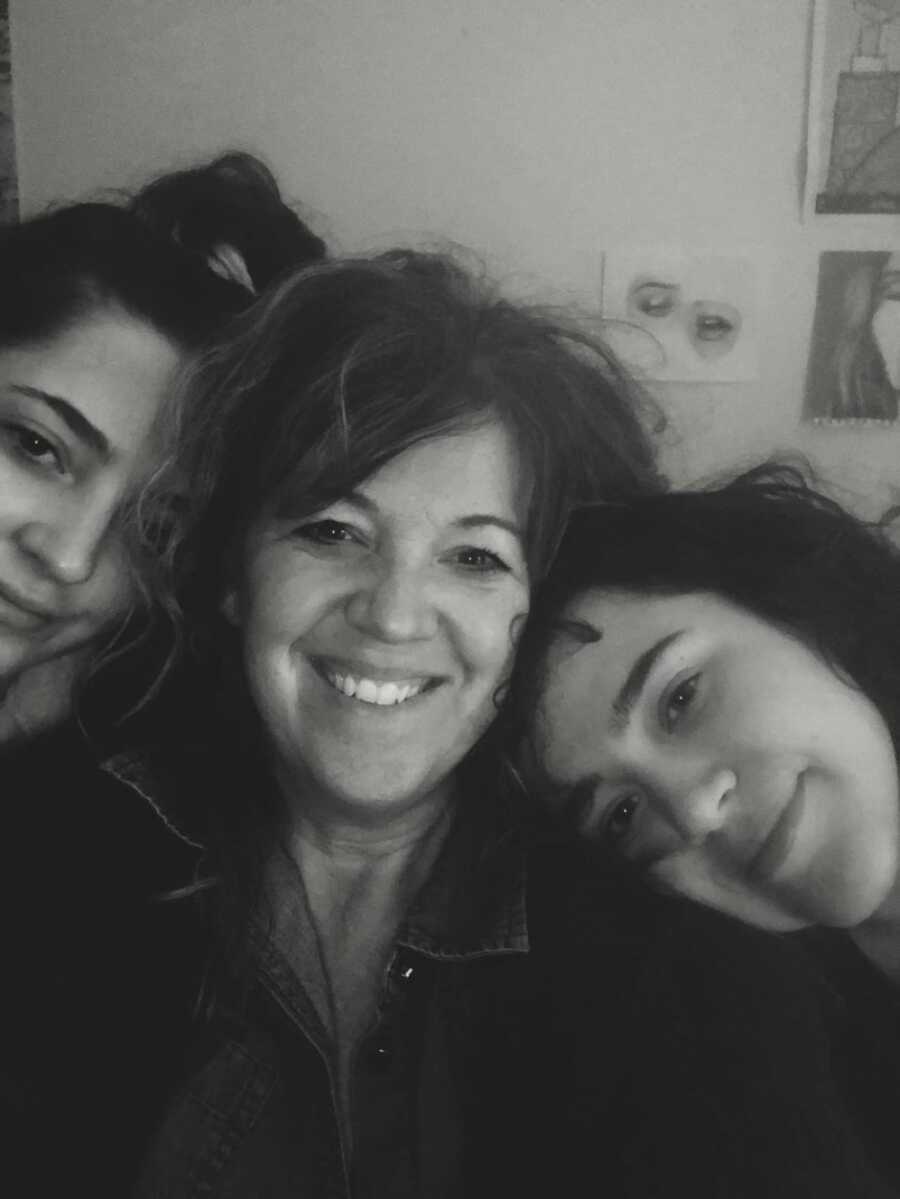 mom taking a black and white selfie with her kids