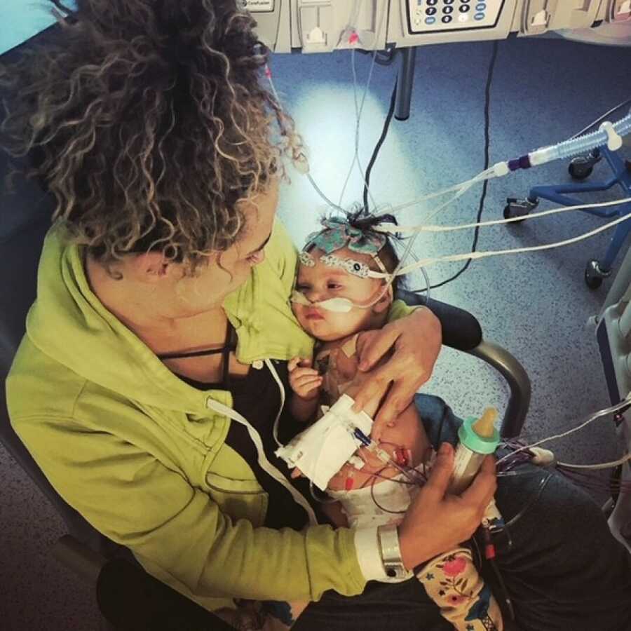 mom holding her baby after the surgery