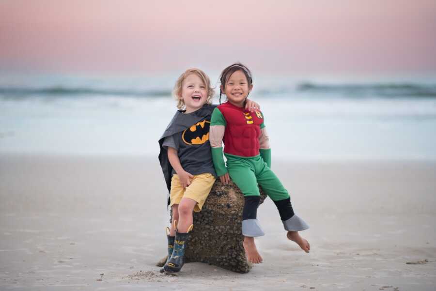 siblings dressed up as batman and robin