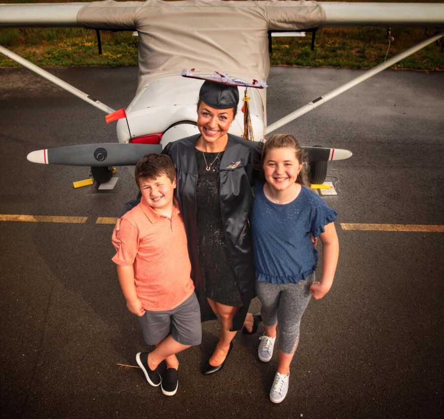 mom graduating with her daughter and son