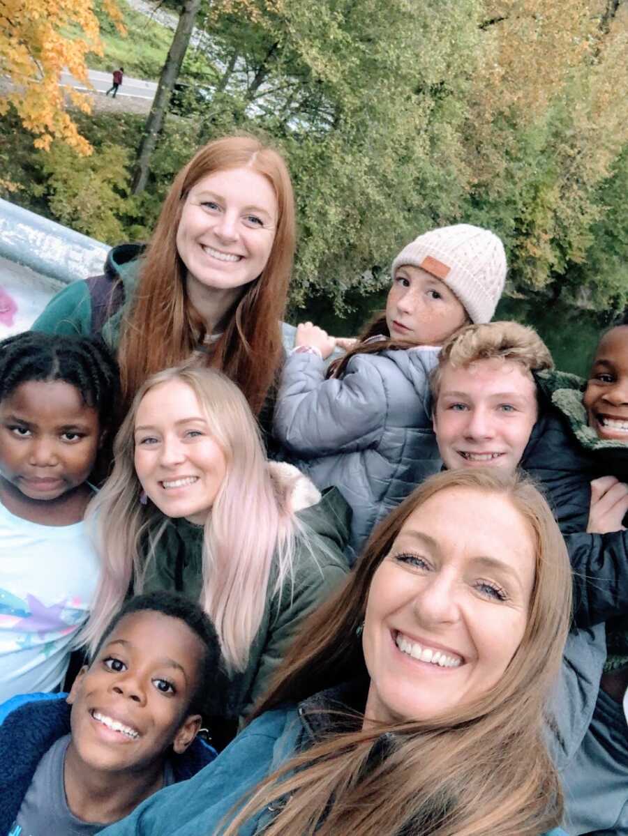 Mom takes a selfie with her children, both biological and adopted