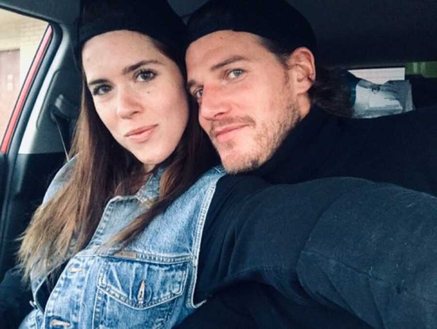 International couple take selfie in a car 