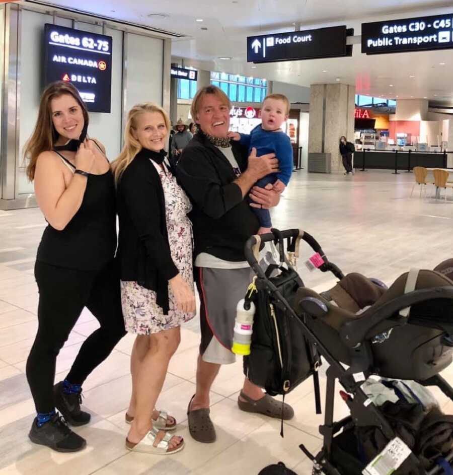 family meets at the airport to meet grandson for the first time