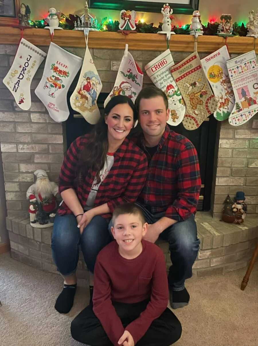 family sitting around their stockings