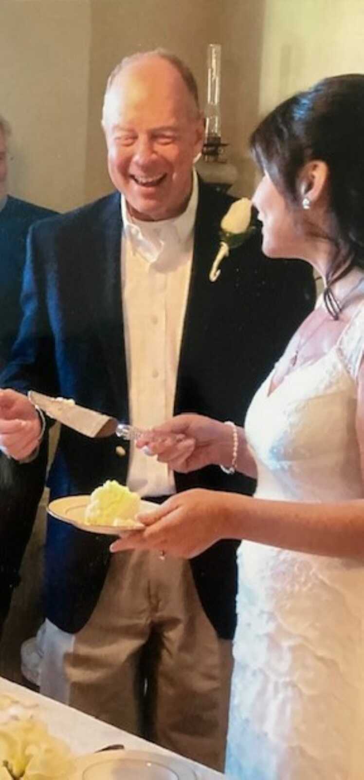 Newlyweds cut their wedding cake at their wedding reception