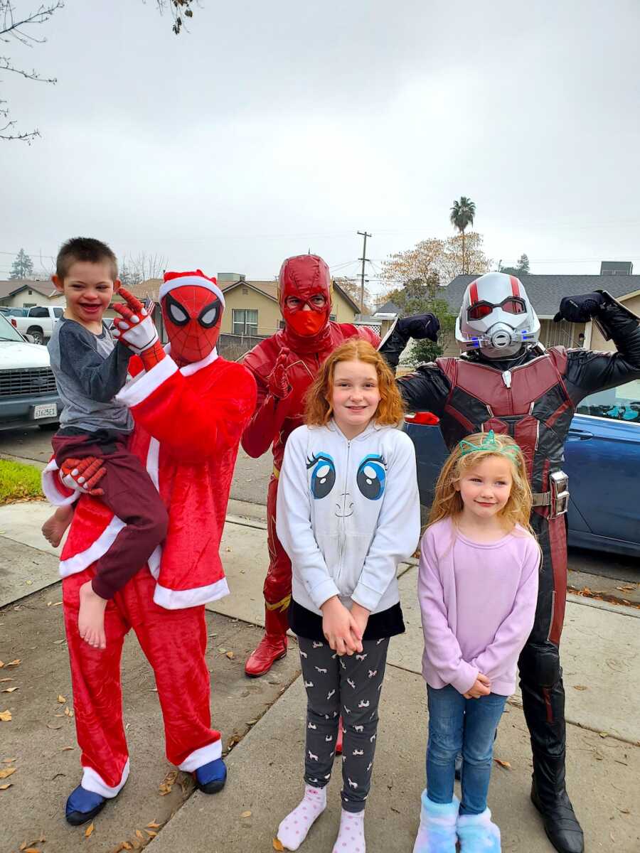 children pose while dressed in halloween costumes 