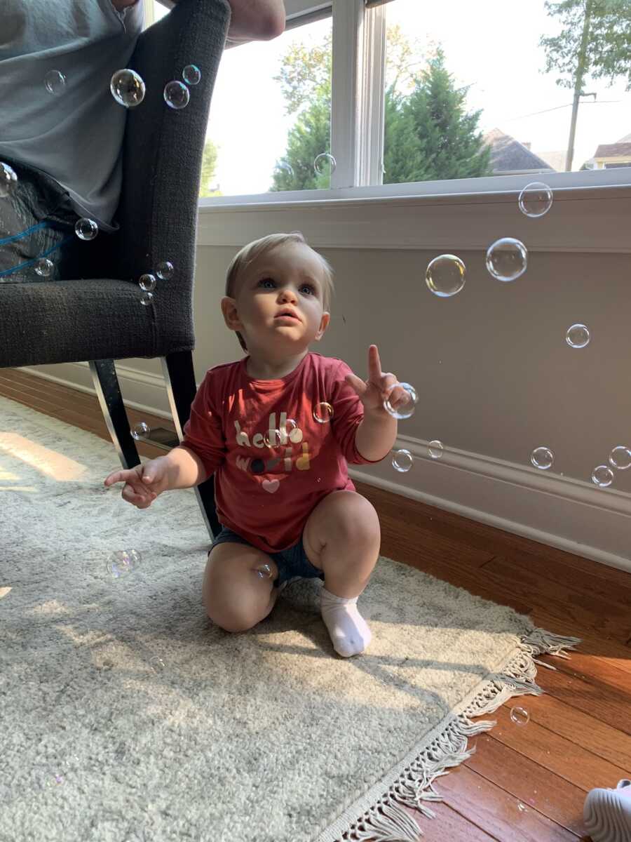baby blowing bubbles