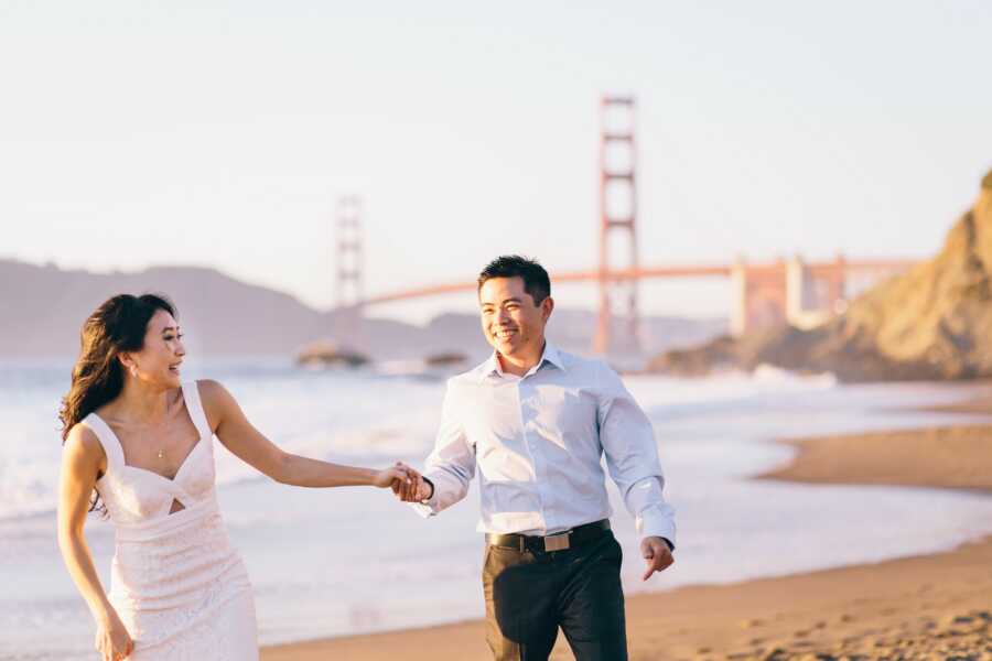 married couple holding hands after wedding in san fran