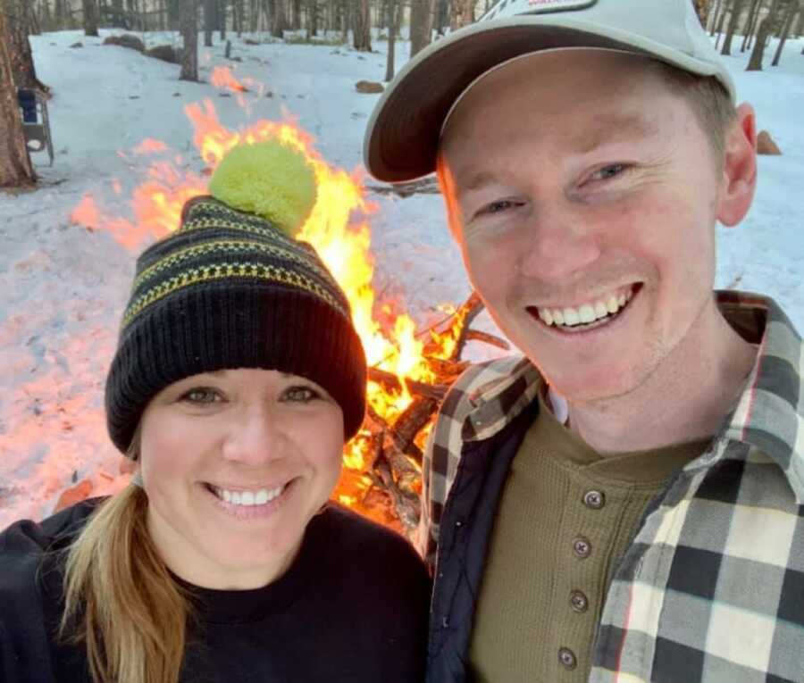 selfie of husband and wife at a bonfire