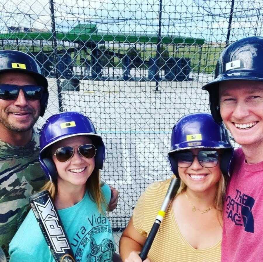 couples at the batting cages