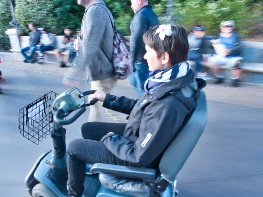 woman riding around in a scooter
