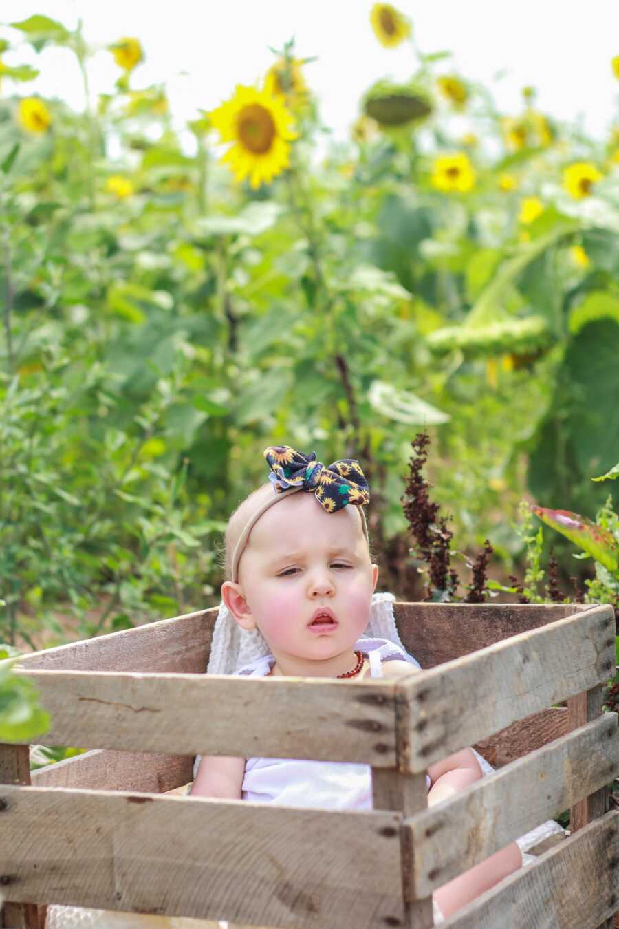 little girl in the wagon in flowers