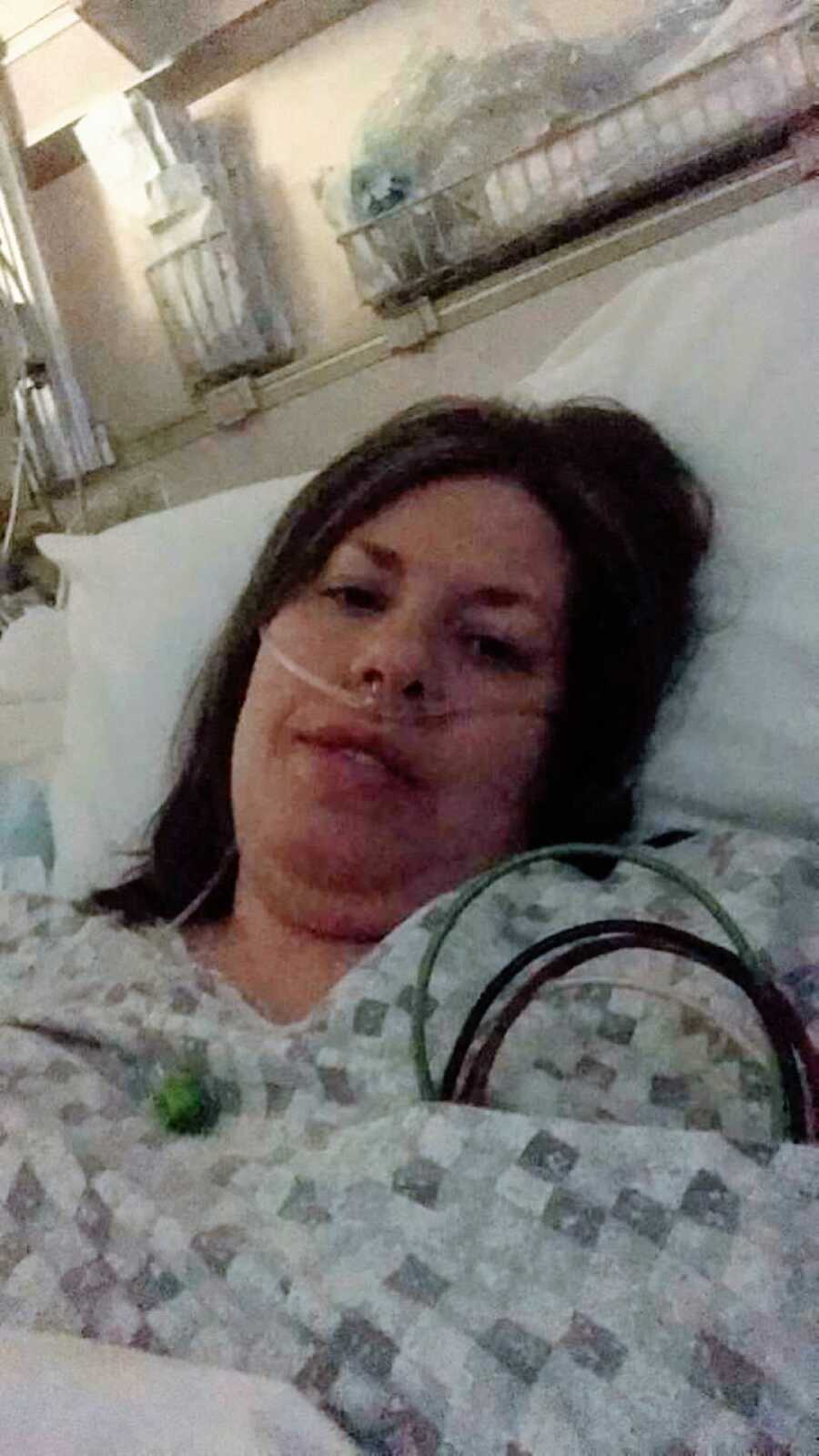 Mom battling stage 4 colon cancer takes a photo while in the hospital