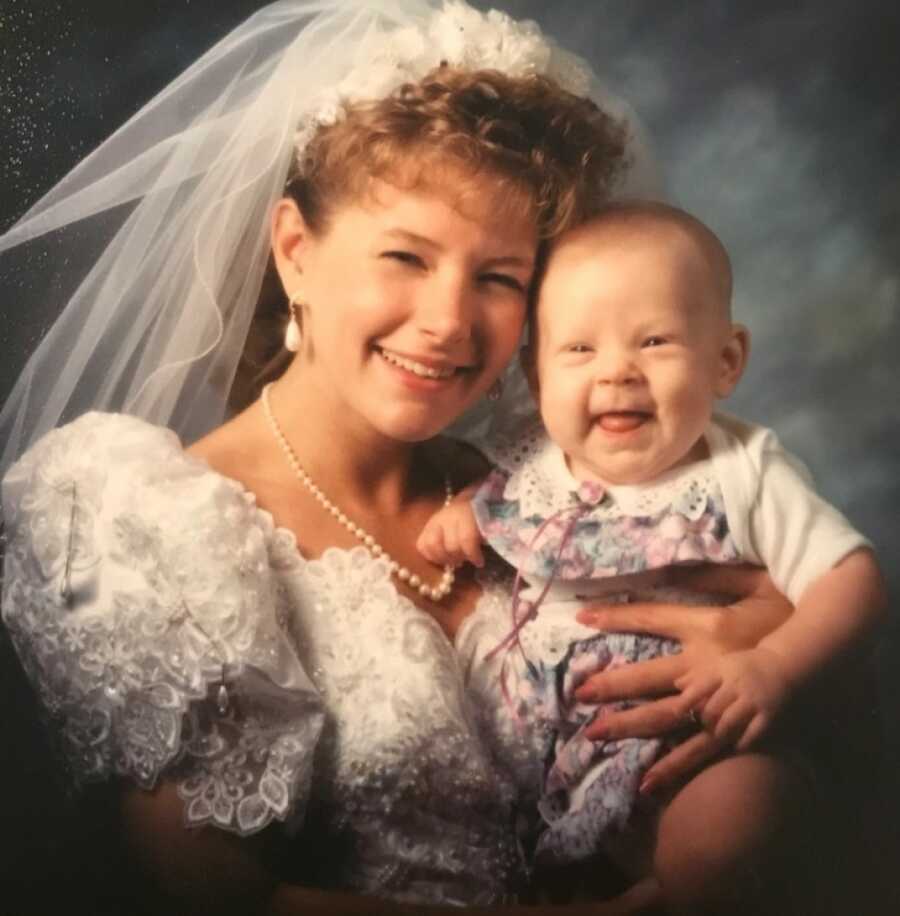 aunt holding her niece close while smiling