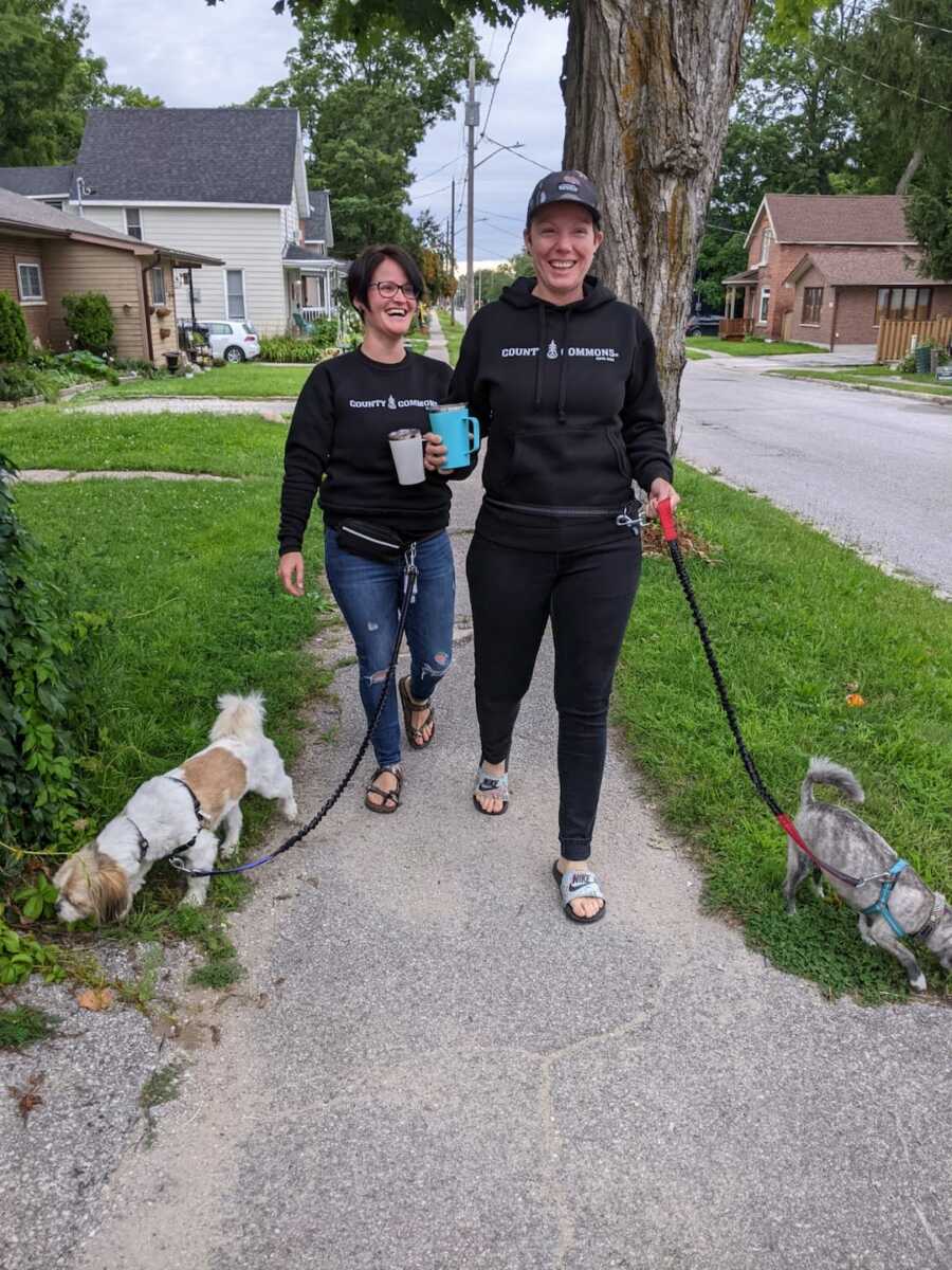 couple walking their dogs together