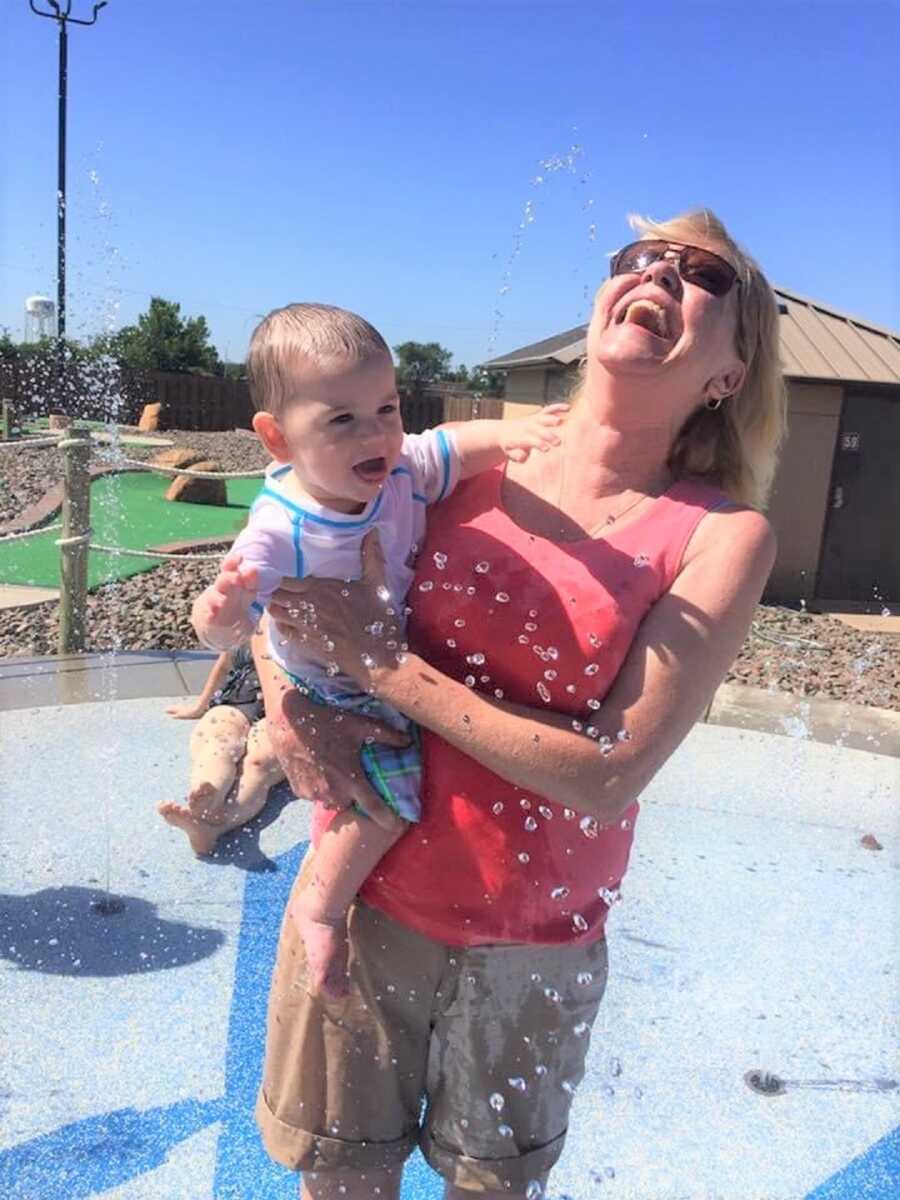 baby girl shares happy moment with laughing mom who struggles with addiction