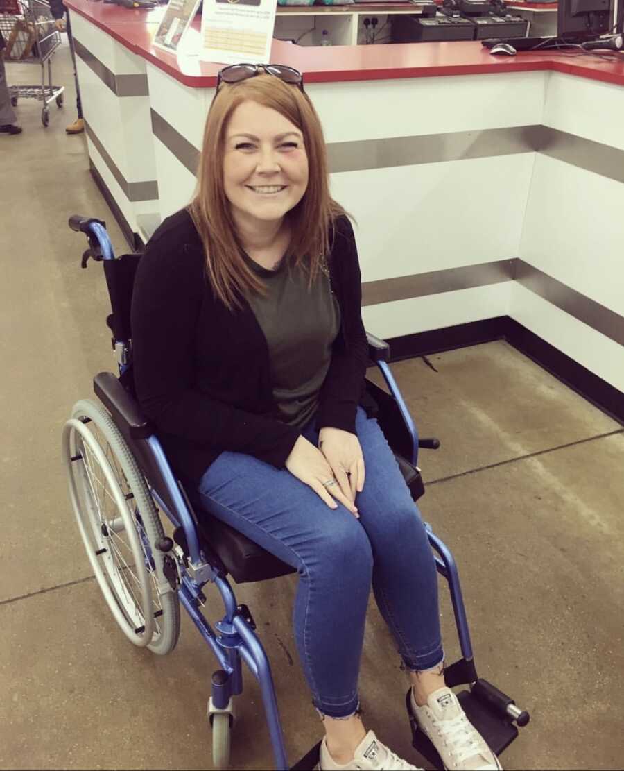 woman smiling in a wheelchair