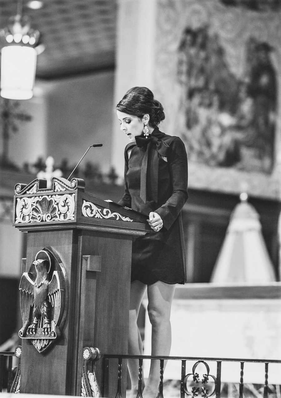 widow delivering Eulogy at husband's funeral at catholic church 