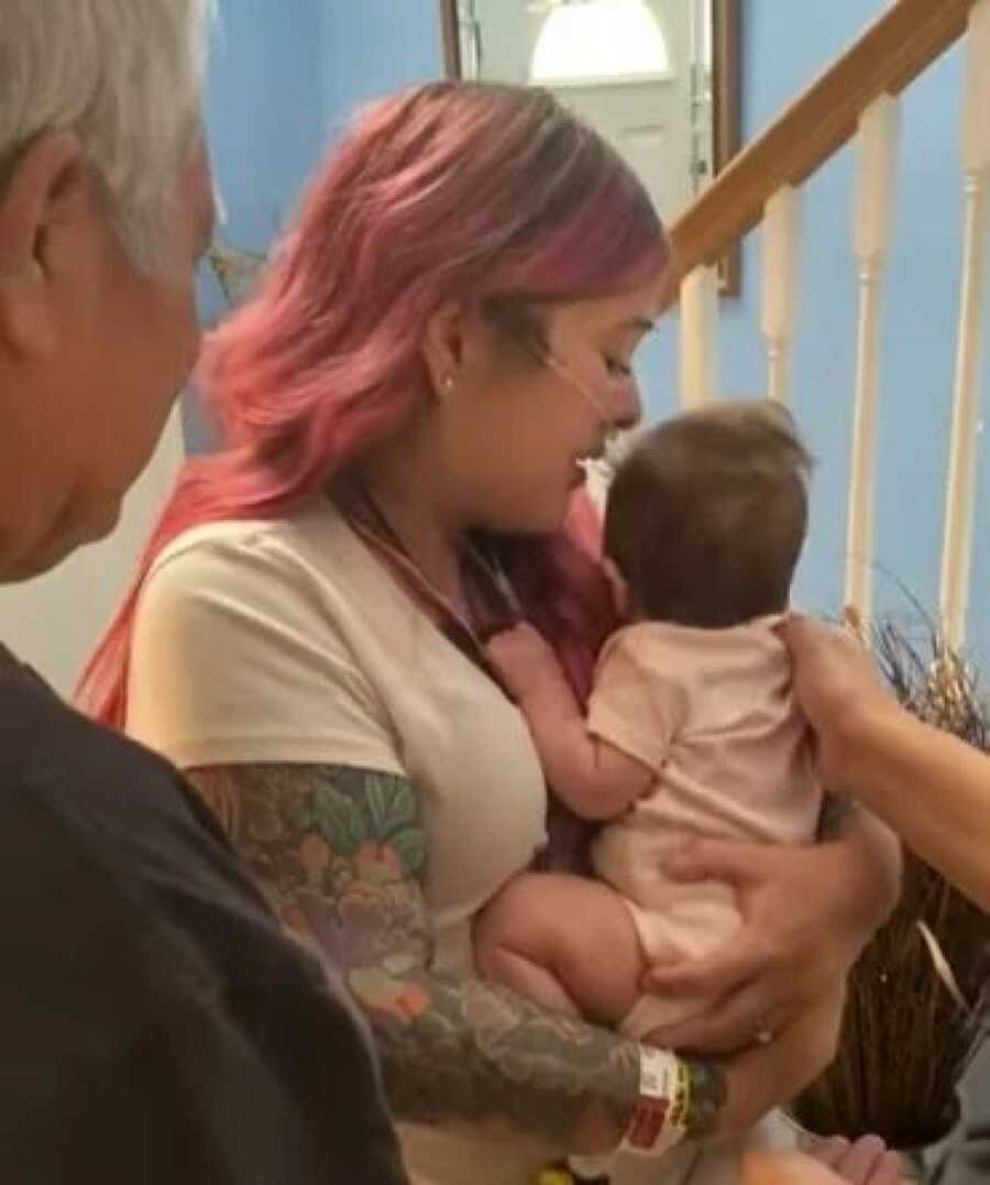 mom holding her baby for the first time