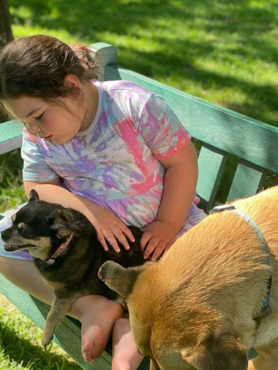 little girl with dogs