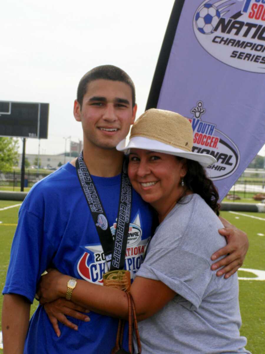 mom with her son at his soccer tournament