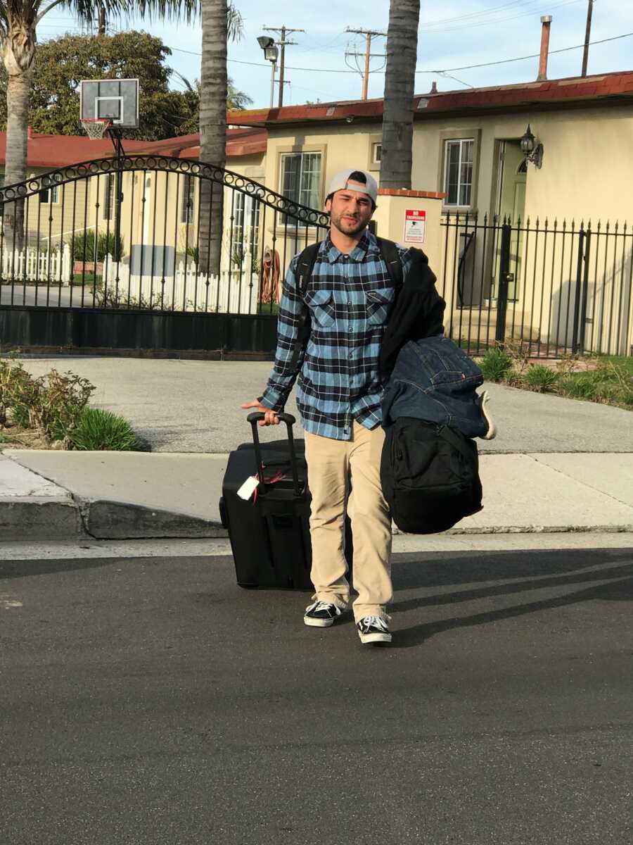 son with his belongings to move into school