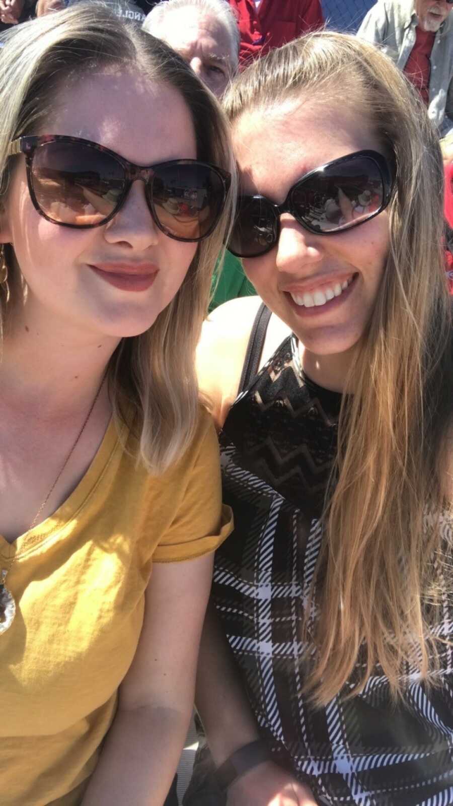 woman taking a selfie with her friend