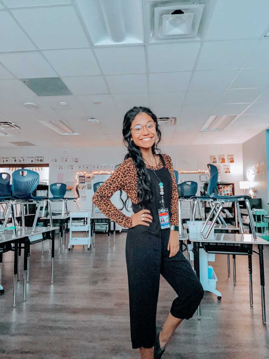 Third grade teacher takes a photo of herself in her classroom before the students arrive for the day