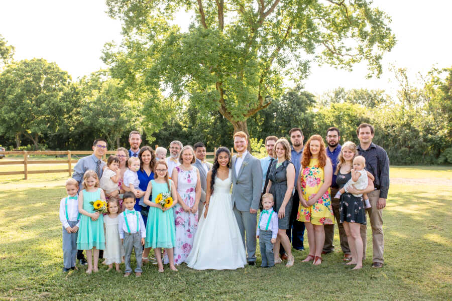 Newlyweds take huge group photo with each sides of their family