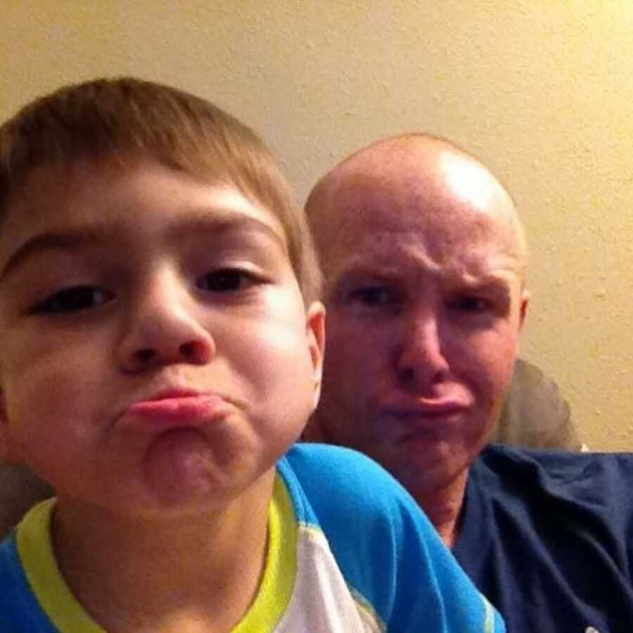 adopted son making a face with his dad
