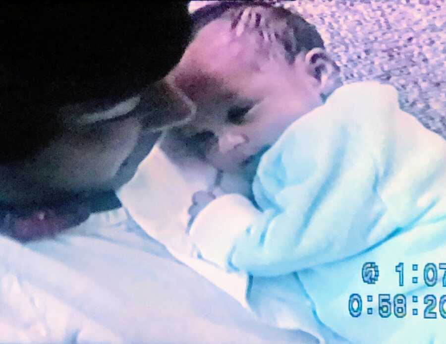 A newborn baby and her mother together in the hospital