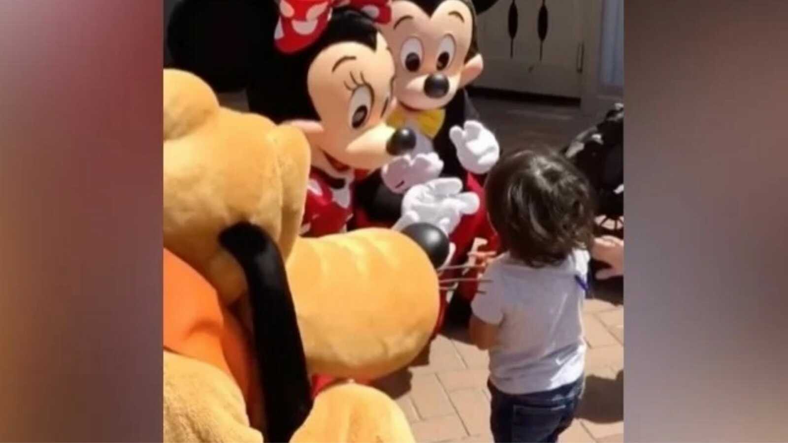 little boy meeting mickey and minnie mouse