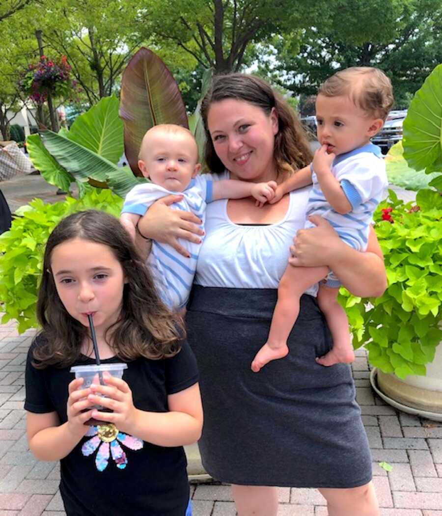 Mother with her daughter and two sons that were adopted at birth