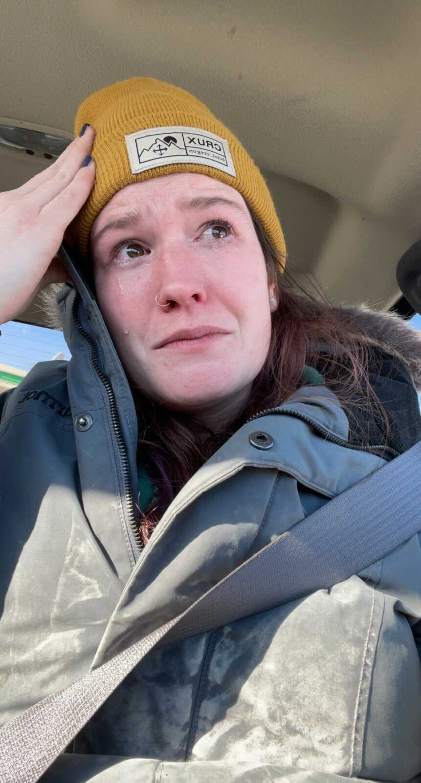 woman crying in her car