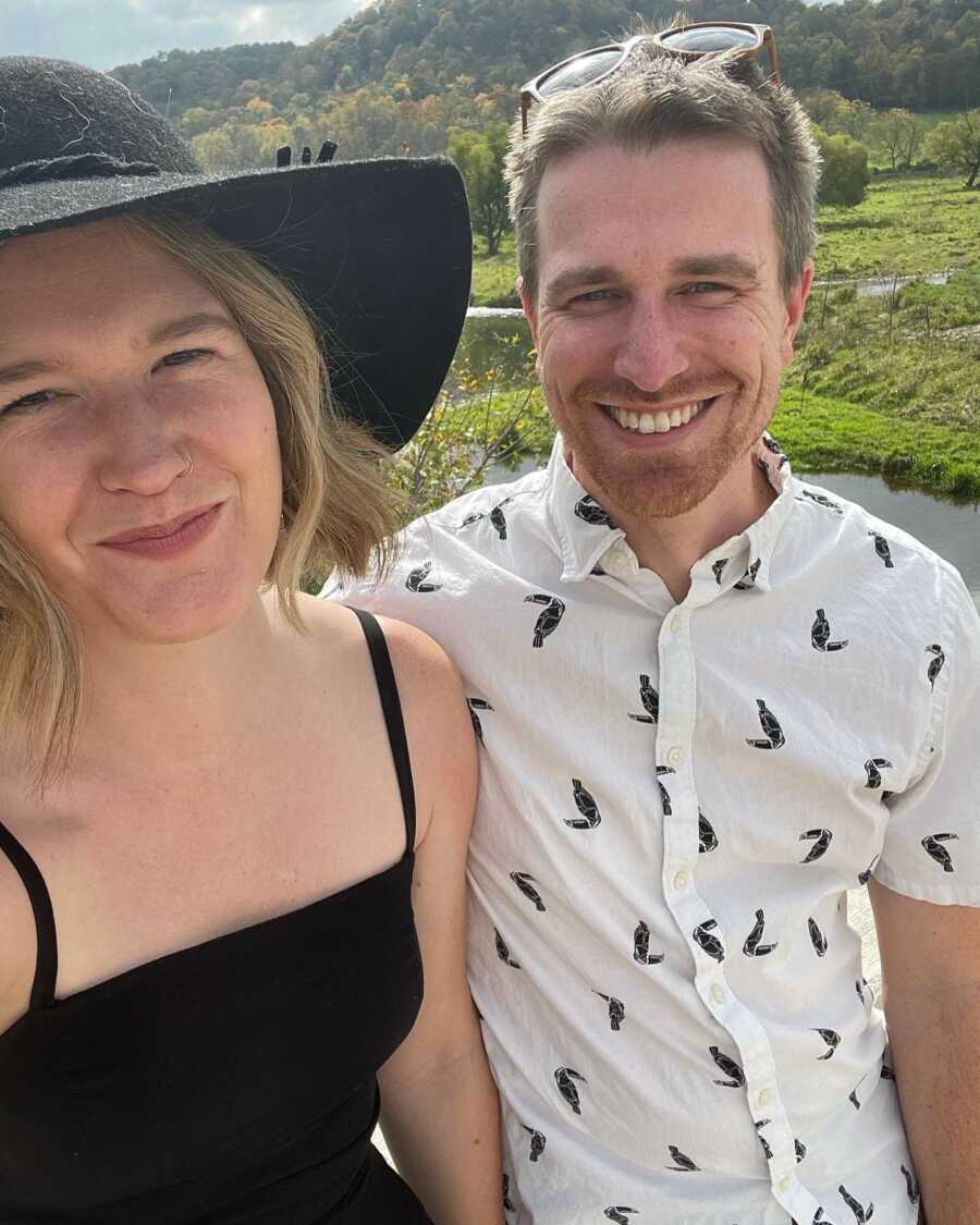 woman smiling and taking her selfie with her boyfriend