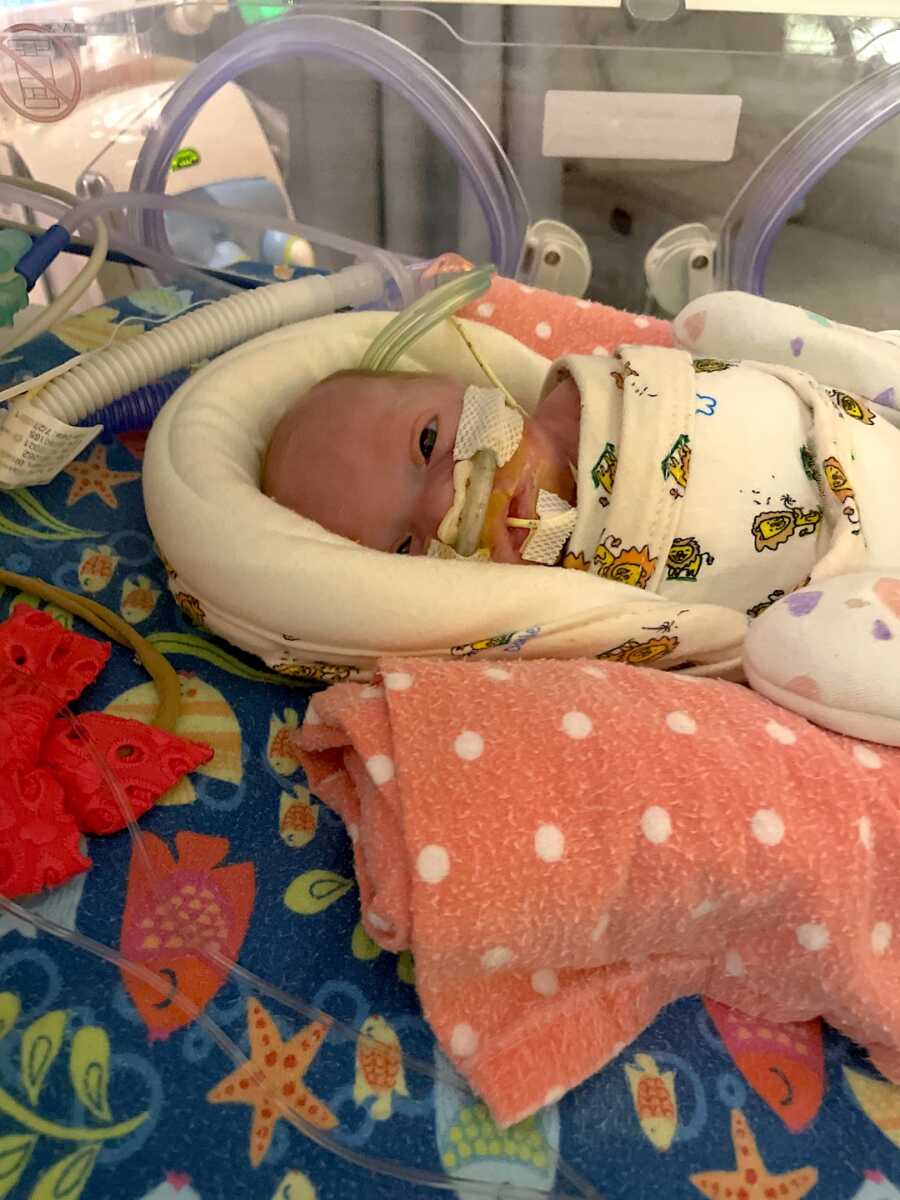 preemie baby girl in nicu hooked up to machines and monitors
