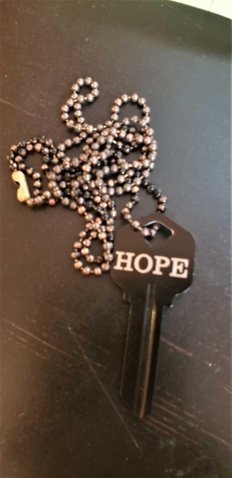 key of hope with sobriety date on it