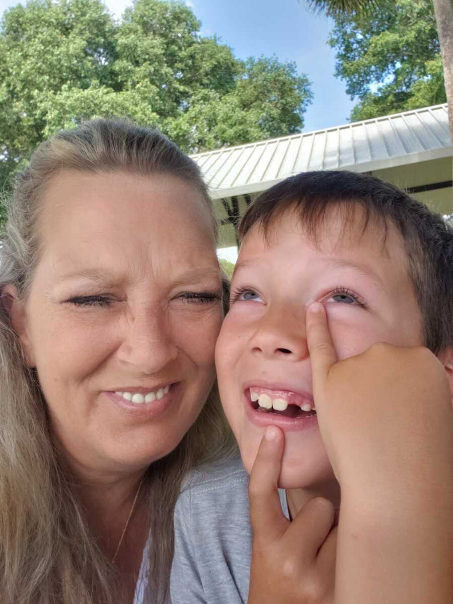 grandma laughing with grandchild who saved her