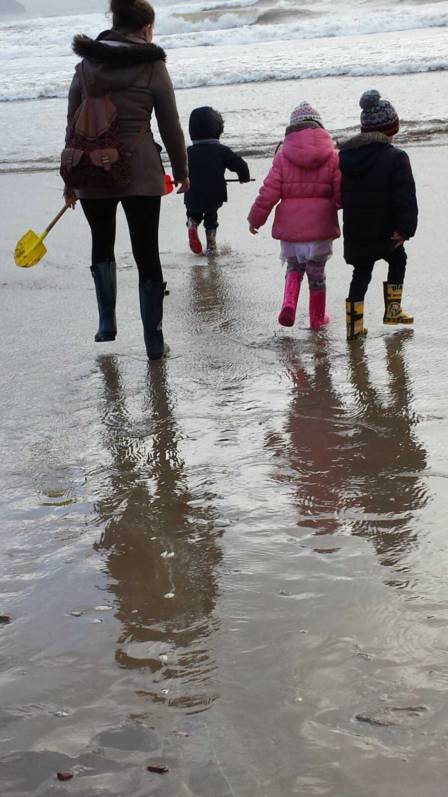 family walking on the beach