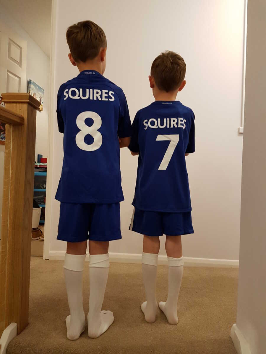 boys in their new football jerseys