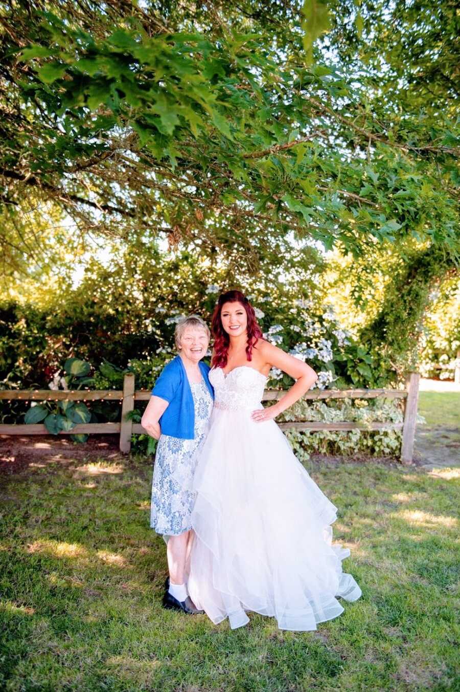 A bride stands with her mother outside