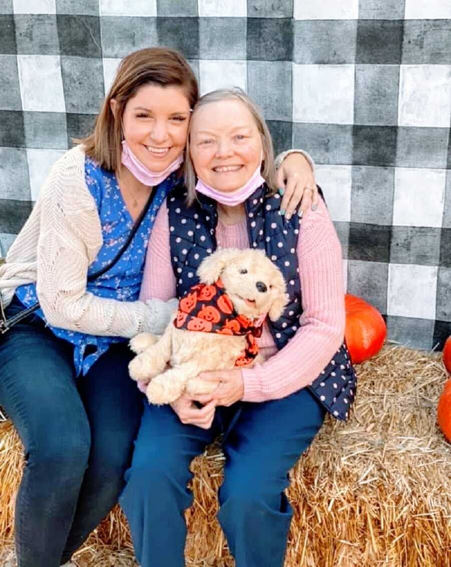 A woman and her mother at a pumpkin farm